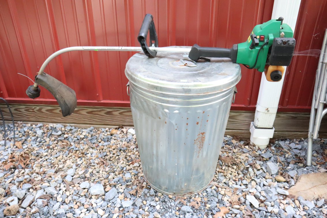 Weed Eater and Metal Trash Can