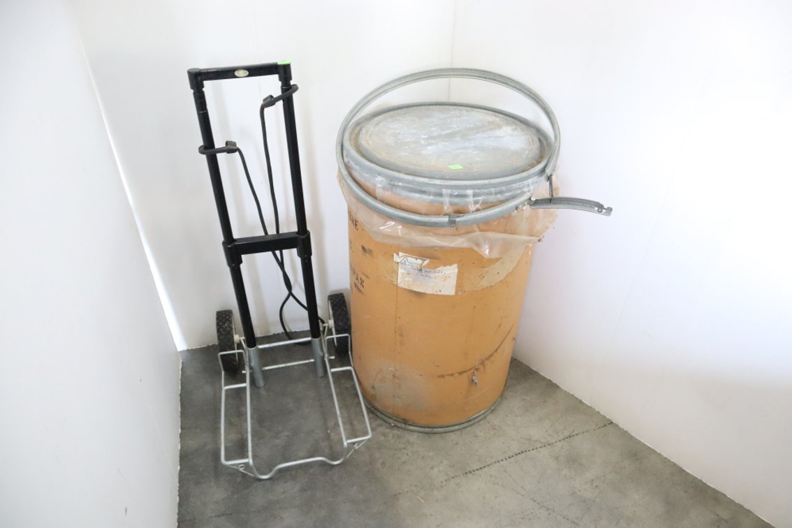 Cardboard Barrel and A Folding Luggage Cart