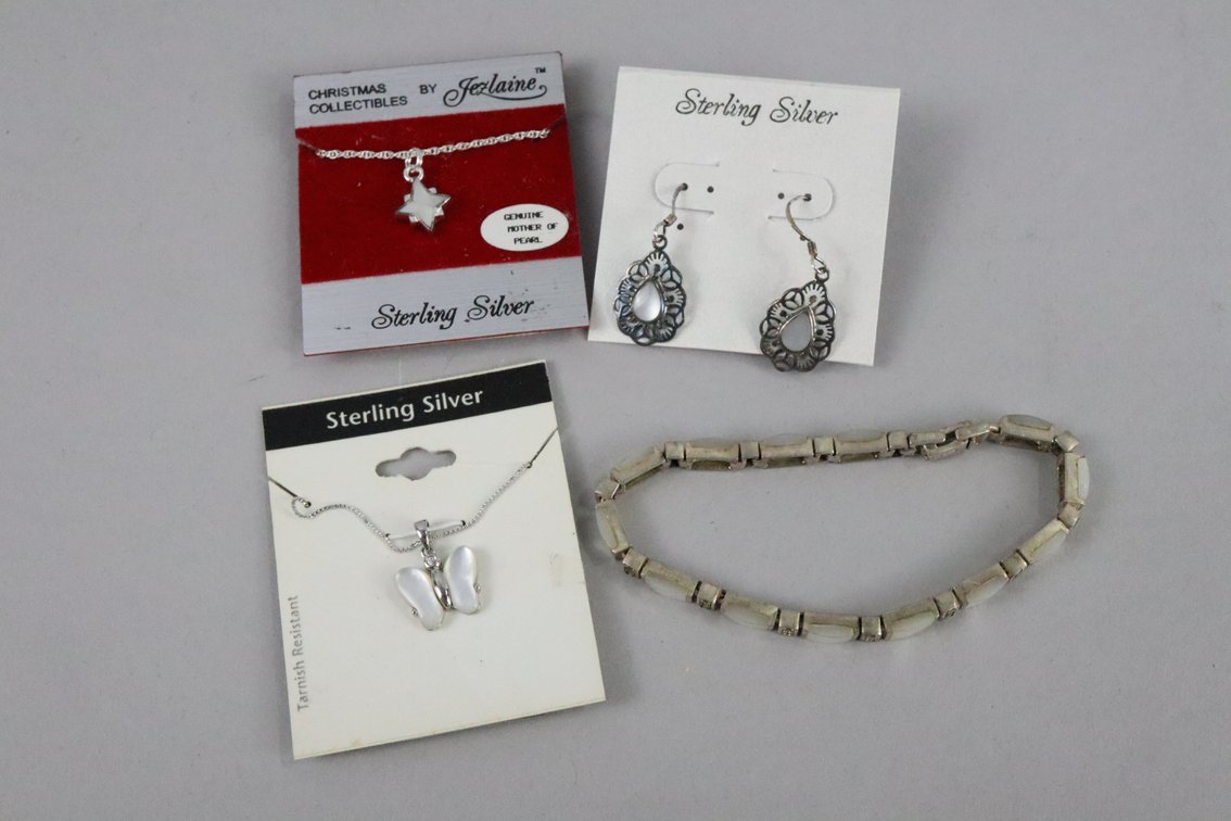 SS mother of pearl bracelet with marcasite, SS necklace with white butterfly pendant, SS mother of pearl star necklace, SS dangle earrings with mother of pearl stones, 