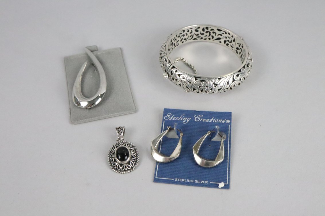 Silver bangle with carving detail, SS hoop earrings, SS pendant with black stone, SS brooch