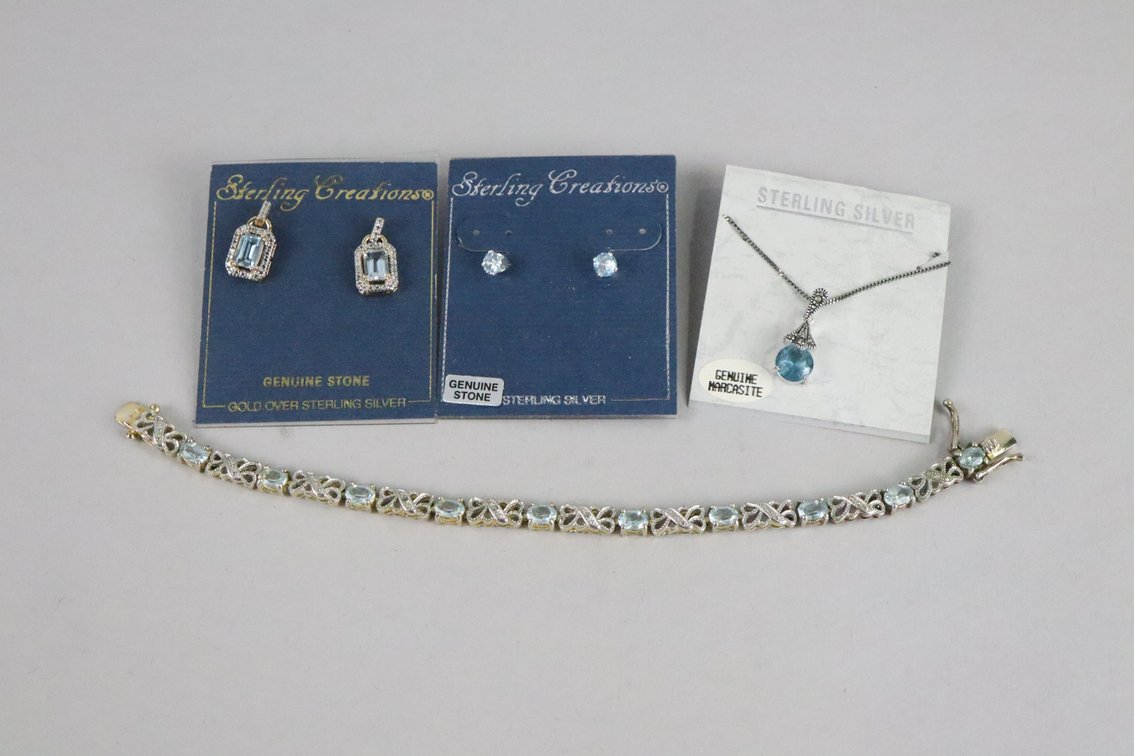 Gold over SS Blue Topaz D/A earrings, SS genuine blue stone stud earrings, SS blue stone and marcasite pendant with chain, SS with blue and white stones tennis bracelet