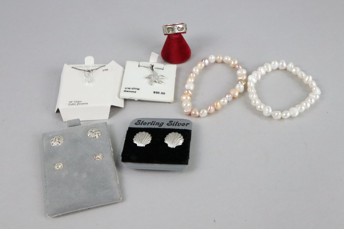 SS shell earrings, SS sand dollar earrings with SS rose studs, SS foot print ring, SS 1/10 CTTW diamond sea star pendant with chain, SS CZ flip flop pendant with chain, 2 freshwater pearl bracelets