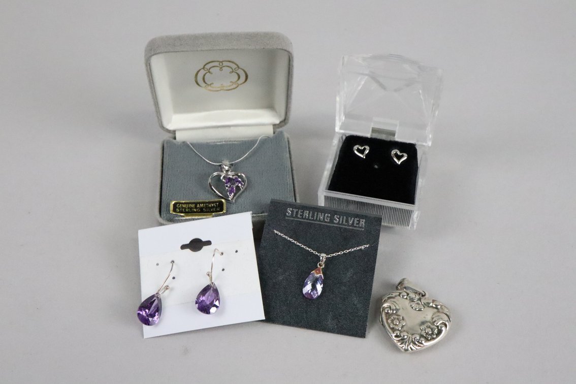 SS Amethyst heart shaped pendant on chain, SS pear shaped purple stone pendant on chain, Silver dangle earrings with purple pear shaped stones, small silver heart shaped studs, SS heart locket