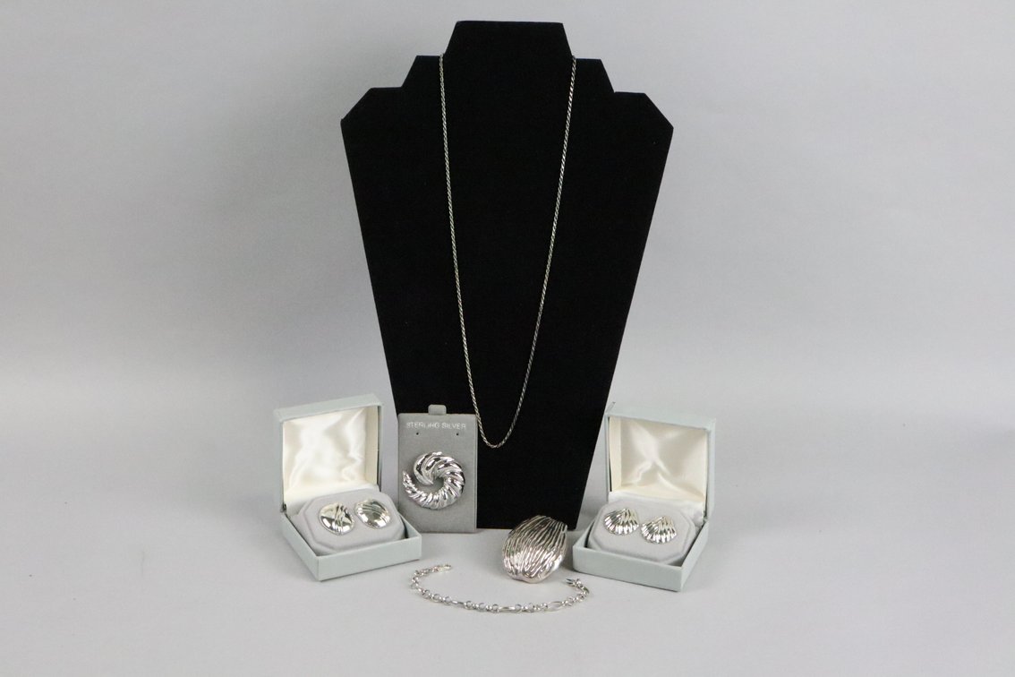 SS 24" rope chain, SS large pendant, SS 7"bracelet, SS swirl brooch, SS earrings, SS oval earrings