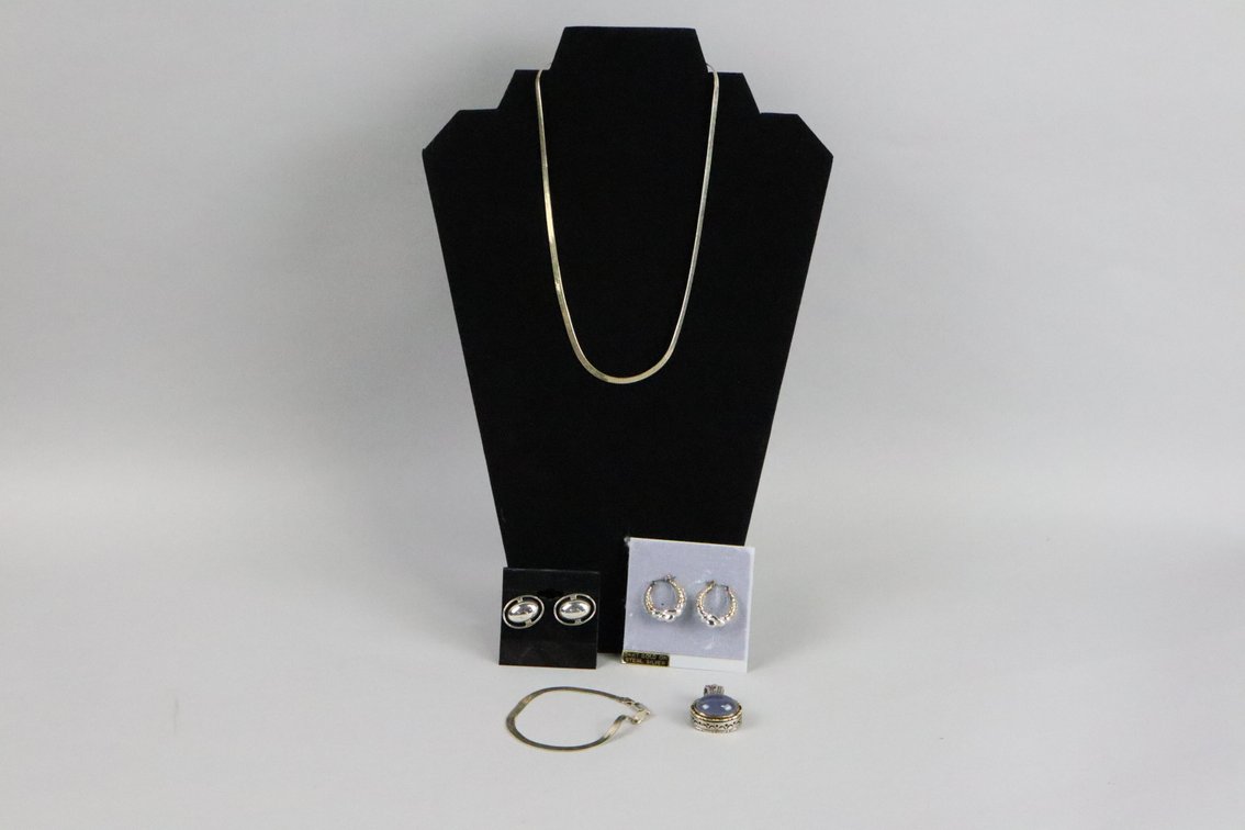 18" SS chain, 7 3/4" SS bracelet, 24K on SS hoop earrings, SS and 18k pendant with grey/purple oval stone, SS oval earrings 