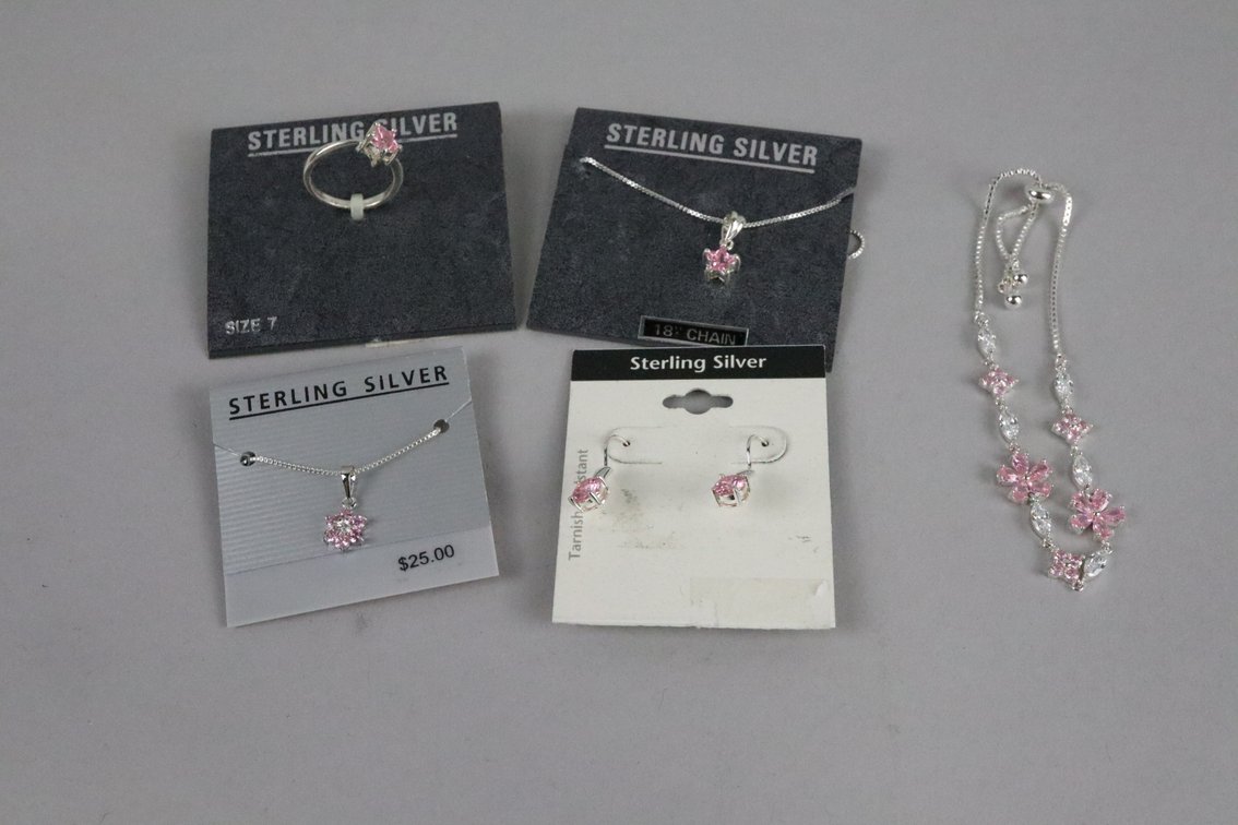 SS flower pendant with pink and white stones on a chain, SS bracelet with pink and white stones, SS pink stone drop earrings, SS pink stone star ring, SS pink stone star pendand on chain