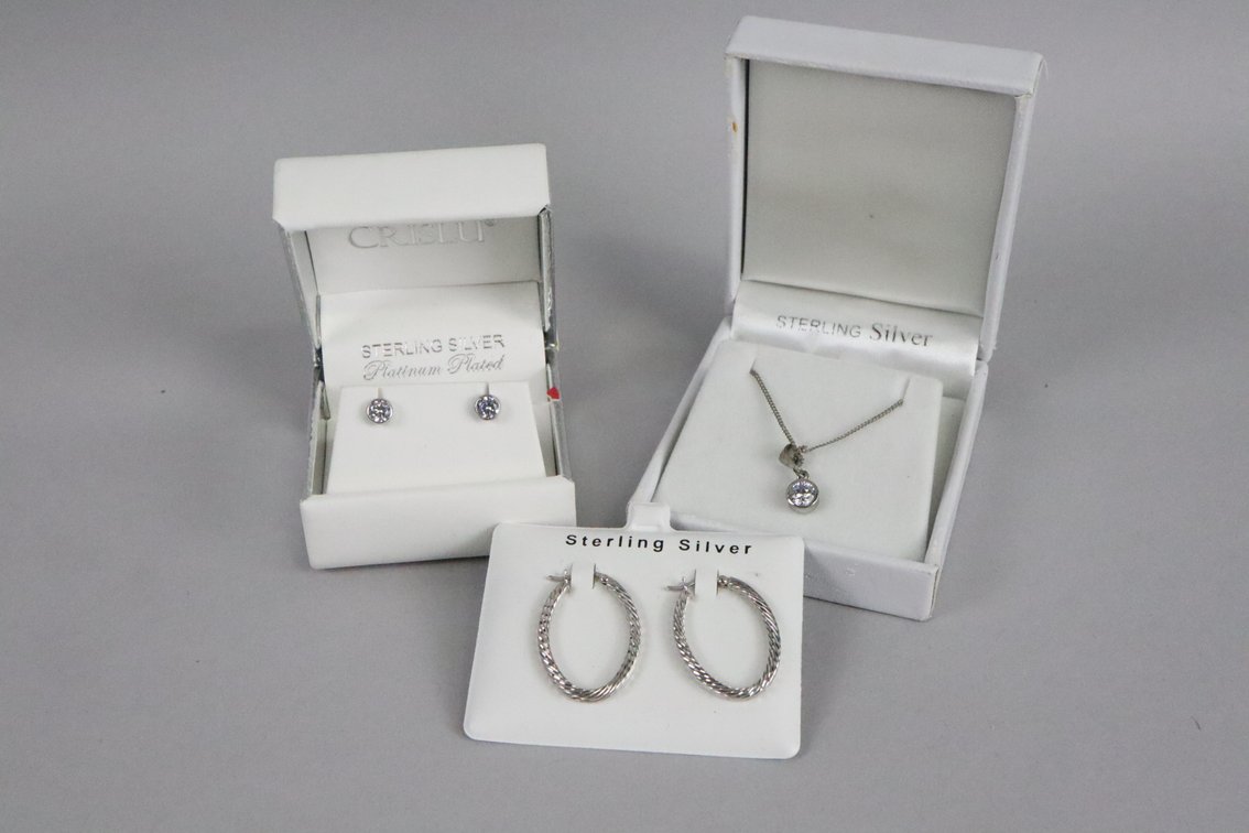 SS bezel set white stone pendant on chain, SS platinum plated bezel set stud earrings, SS oval hoop earrings 