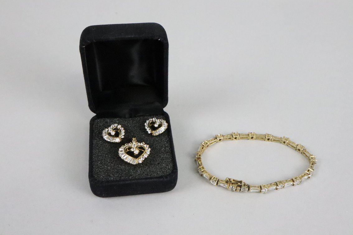 14k over SS heart pendant with CZ's and matching earrings, SS gold colored tennis bracelet with white stones