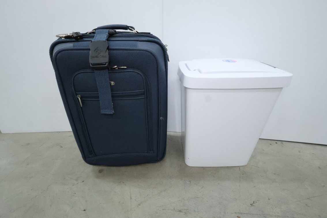 Suitcase and Trash Can