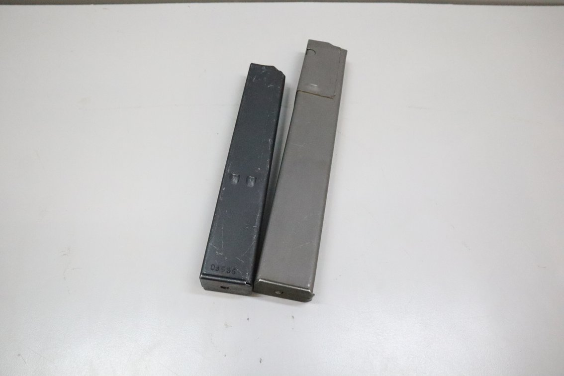 Two Metal Stick Firearm Magazines