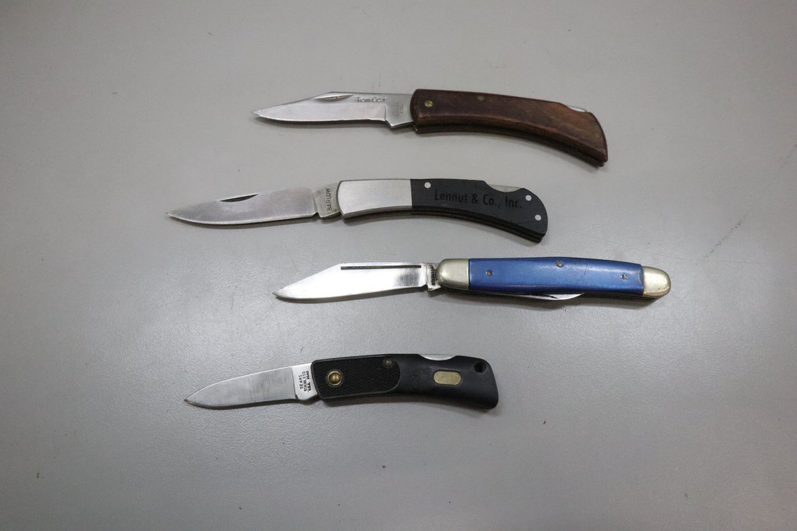 Four Folding Pocket Knives Including Sears, Barlow, and Tom Cat