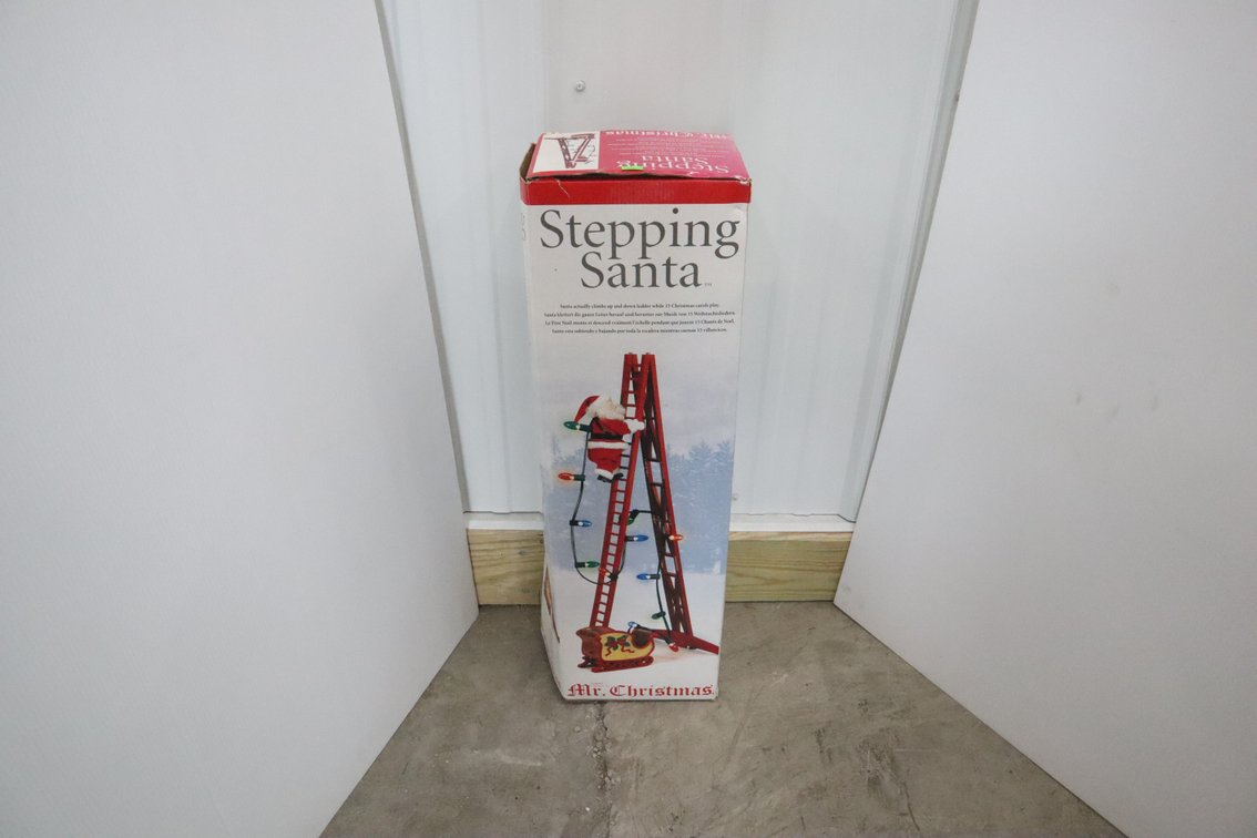 Stepping Santa Figurine