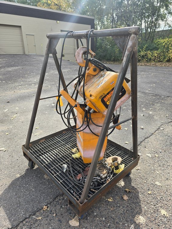 Harrington Code NER050L 5 Ton Electric Chain Hoist on Metal Frame Storage Cart.