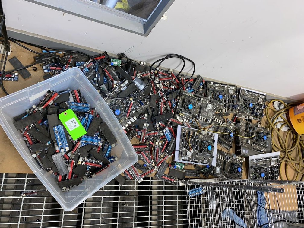 Group of Cryptocurrency Mining Motherboards and PCIe Risers