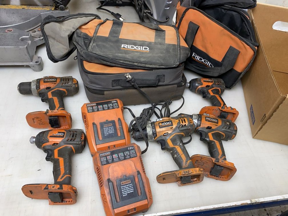 Group of Ridgid 18V Cordless Drills, Impact Drivers and Chargers