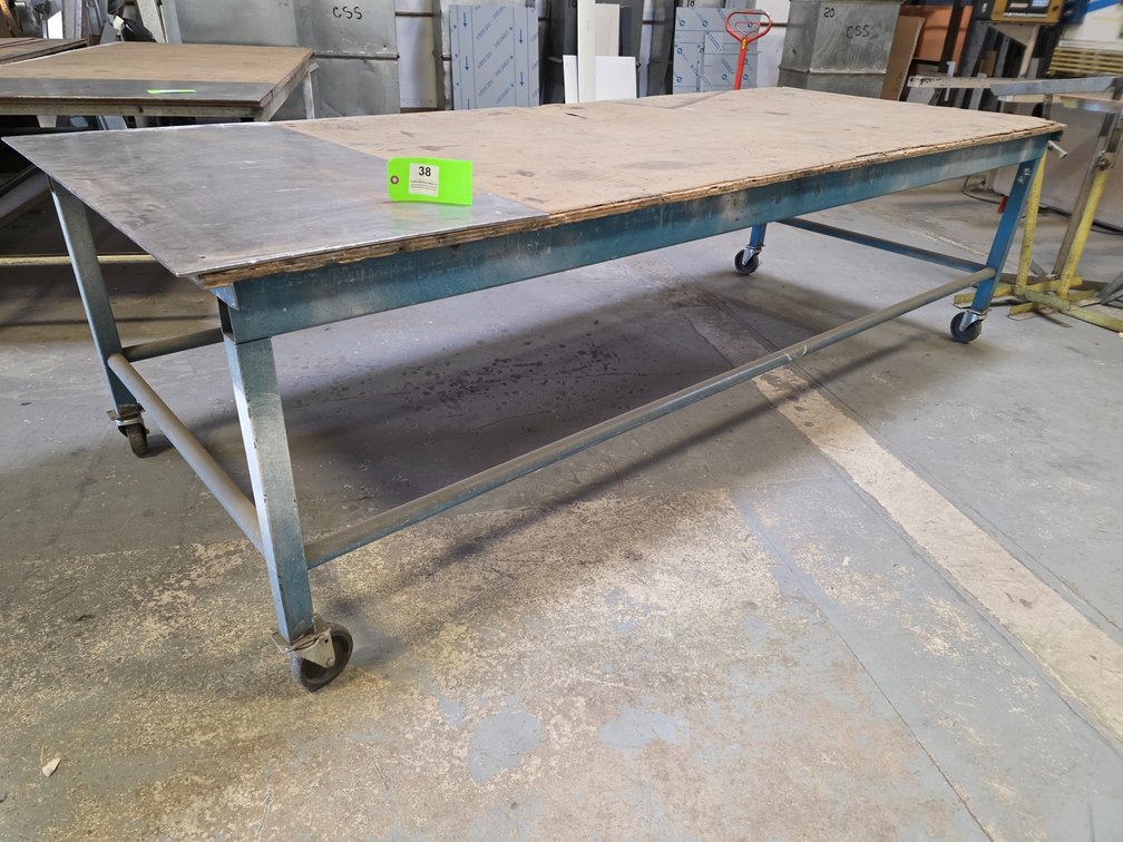 Metal Framed Table on Wheels.