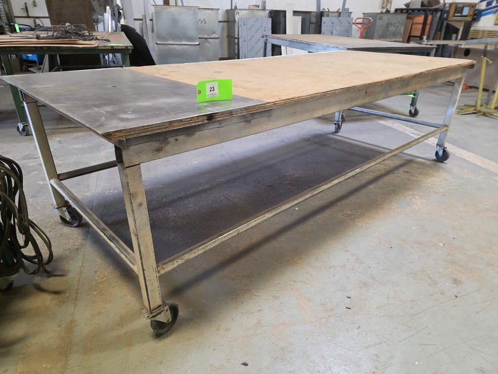 Metal Framed Table on Wheels.