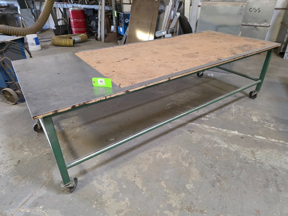 Metal Framed Table on Wheels.