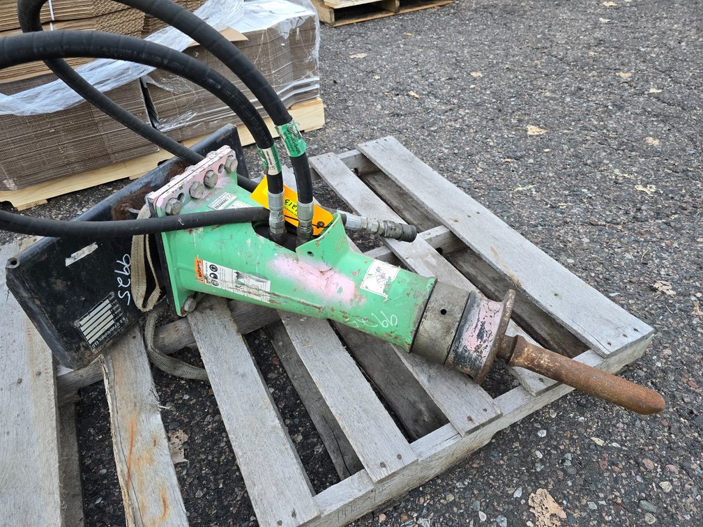 Tramac Model SC 8 Hydraulic Demolition Breaker on a Ditch Witch  Model SK500 Mount.