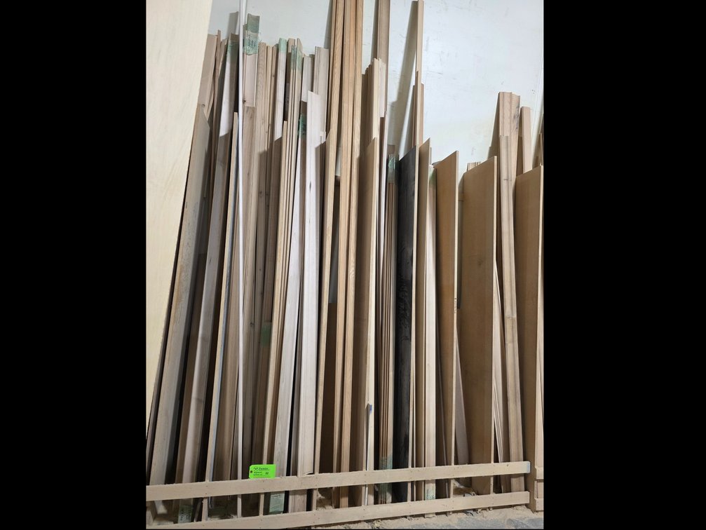 8-Compartment Wood Storage Rack w/ Large Quantity of Assorted Moulding and Trim.