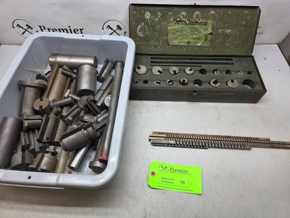 Large Assortment of Broach Bushings and (5) Broaches Shown. 