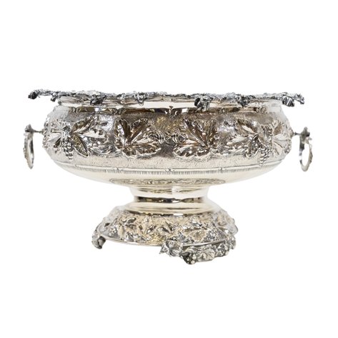 An ornate Greek sterling silver footed bowl with grape repoussé