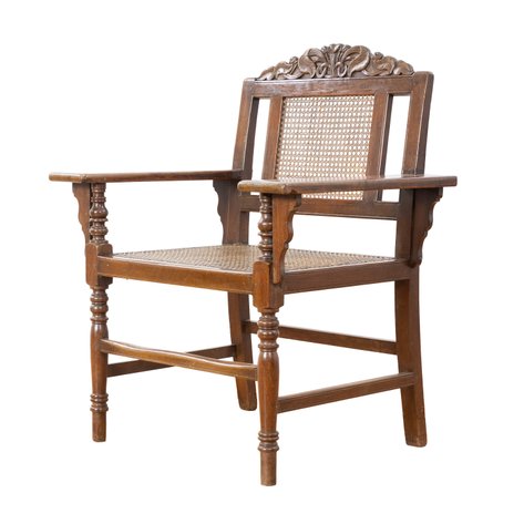 A Neoclassical sillon de fraile / grandfather’s chair with acanthus fan crest and generous proportions