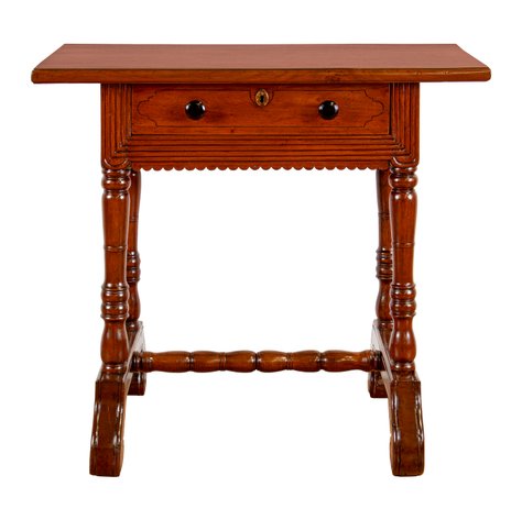 A Baroque Revival pebetera (sewing table) with concentric reeded molding and scroll-toe trestle base