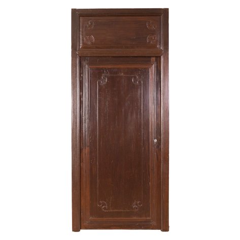 A heritage single-leaf access door set with transom featuring carved Chinese scroll motifs