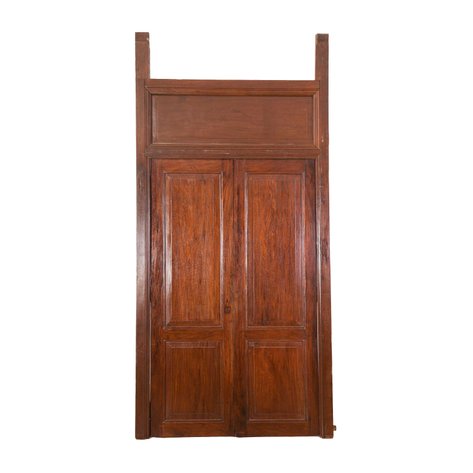 A grand heritage double-leaf internal door set with transom and raised center panels