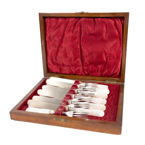 A cutlery set of 6 forks and 6 knives with mother-of-pearl handles