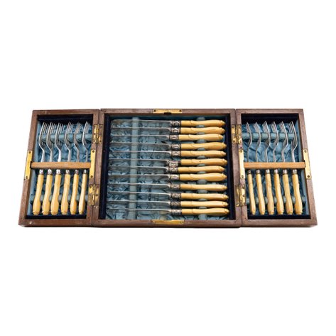 A vintage cutlery canteen set