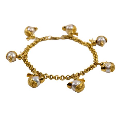 A 14k gold thick bracelet with South Sea pearls and 7 duck charms