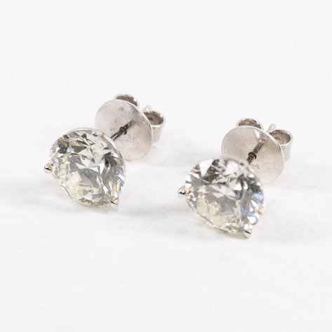 A pair of solo earrings in white gold