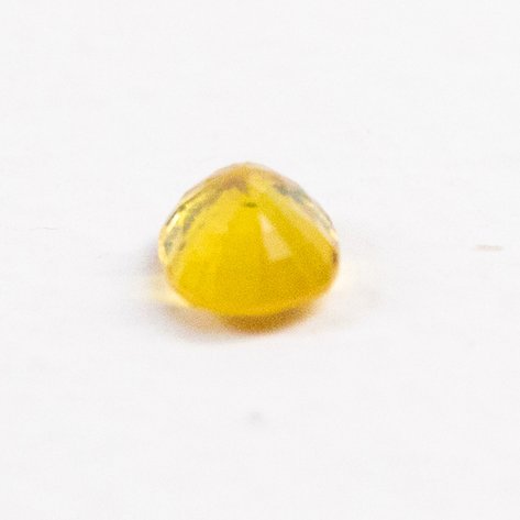 A yellow sapphire oval mixed cut stone