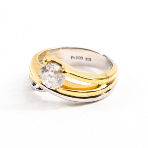 A 1 carat diamond solo ring in 18k yellow gold and platinum setting