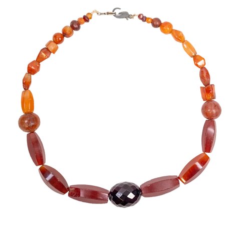 A necklace with glass and carnelian beads