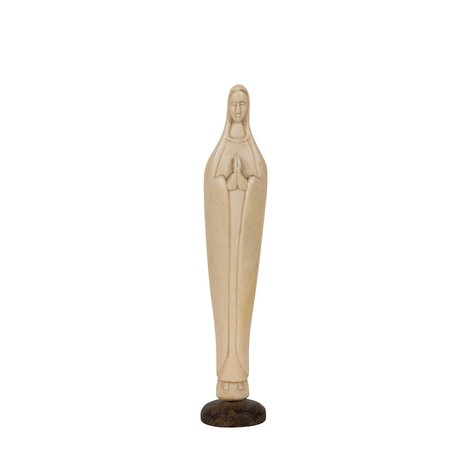 An ivory image of the Virgin Mary in a sleek, minimalist silhouette