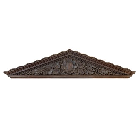 An Estilo Tampinco Neoclassical triangular cabinet pediment featuring high relief bunga (areca) foliage and fruit clusters