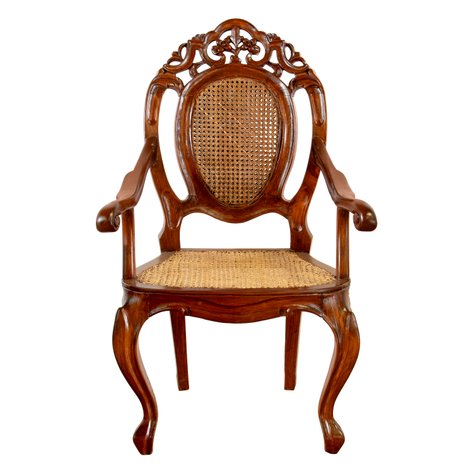 A ‘Mariposa’ armchair featuring an elaborately pierced crest rail with high-relief floral bouquet carvings