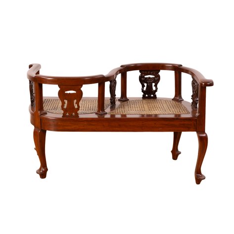 A tête-à-tête double armchair with Rococo-style scrolling cartouche splats