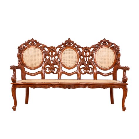 A Victorian style 'Mariposa' sofa with pierced openwork anthemion and acanthus leaf carvings