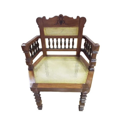 A Renaissance Revival hexagonal armchair featuring finely turned square spindles