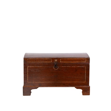 A dome-top baul (chest) featuring elegant bone stringing borders and a central floral keyhole crest