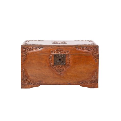 A baul (chest) carved with folk Baroque scrollwork borders