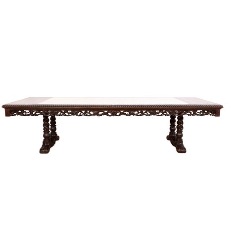 A grand 10–12-seater Renaissance Revival inset marble-top dining table featuring rope-gadrooned borders and heavy barley-twist trestle supports