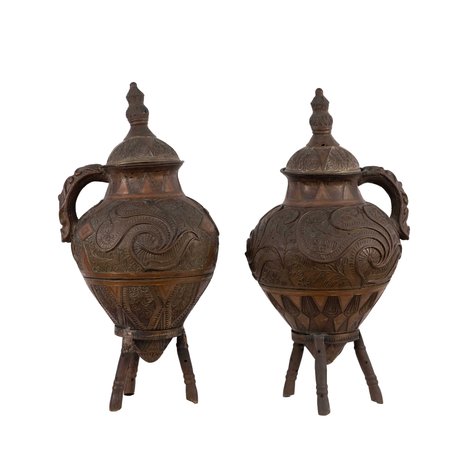 A pair of decorative, lidded vessel made of brass/bronze