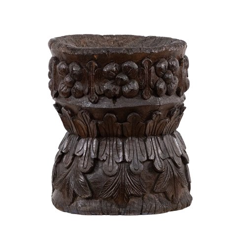 A lusong (mortar for rice, root crops, beans, spices, etc.) featuring carved floral band over acanthus leaf base