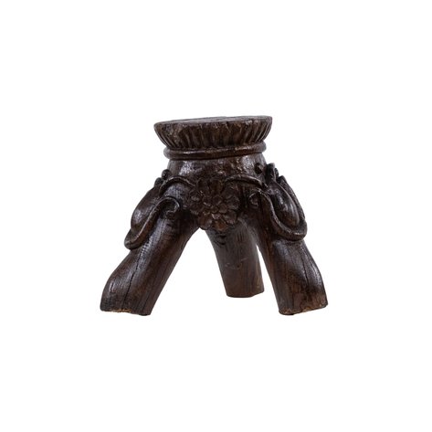 A provincial stool featuring a tri-form base accented with central florets and scrolling foliate brackets