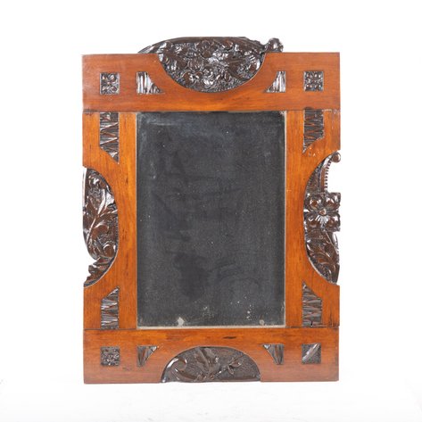 An Estilo Tampinco Art Nouveau mirror frame featuring a gumamela blossom crest and side panels with mixed botanical motifs